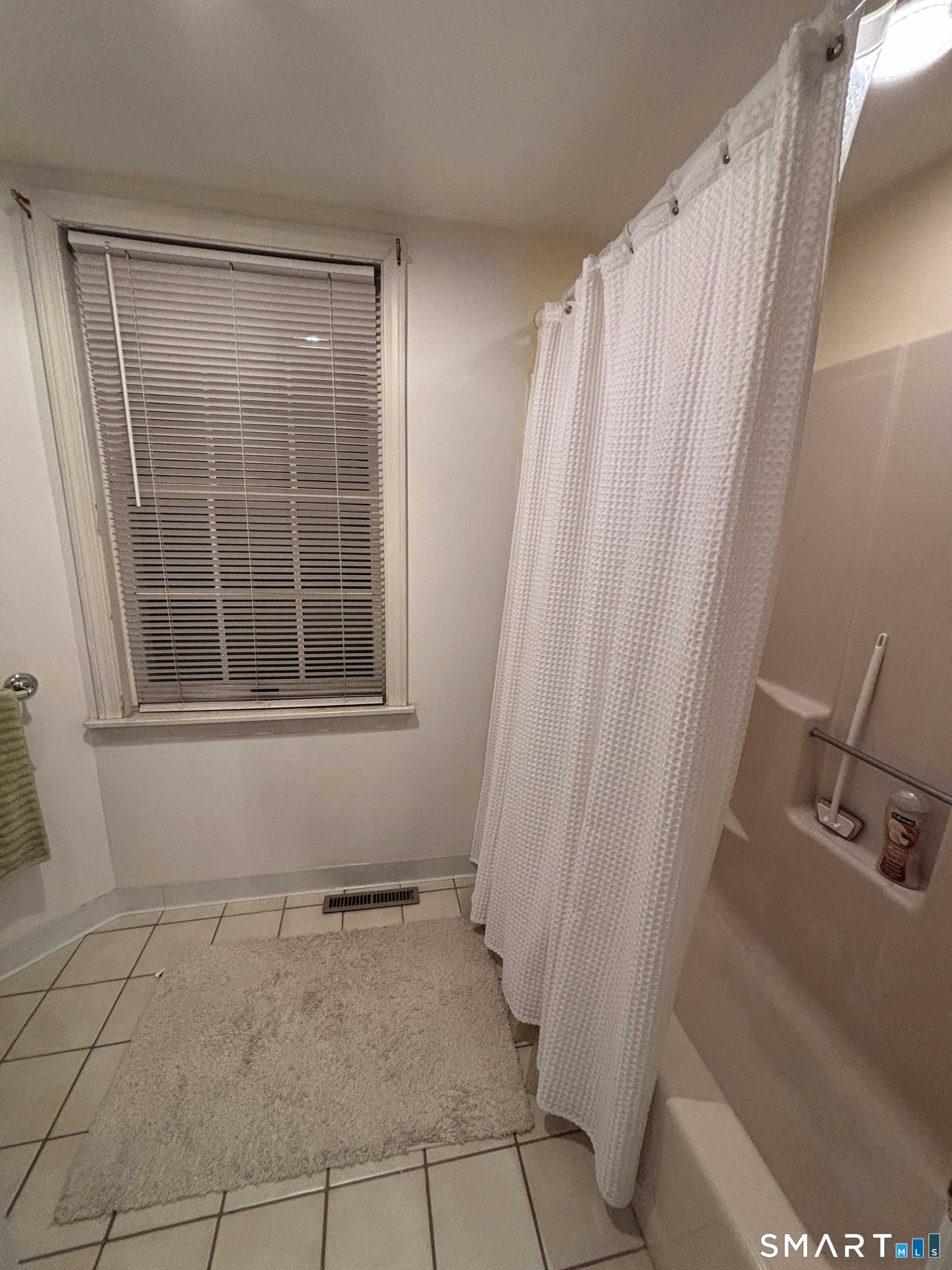 101 Madeline Avenue, Unit 33 Waterbury, CT 06708 - Photo 32 of 41 a bathroom with a window and a shower