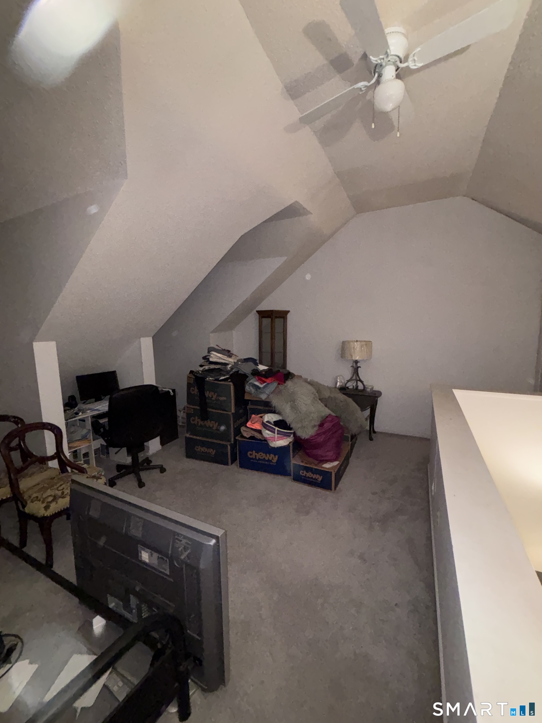101 Madeline Avenue, Unit 33 Waterbury, CT 06708 - Photo 37 of 41 a living room with furniture a flat screen tv and a ceiling fan