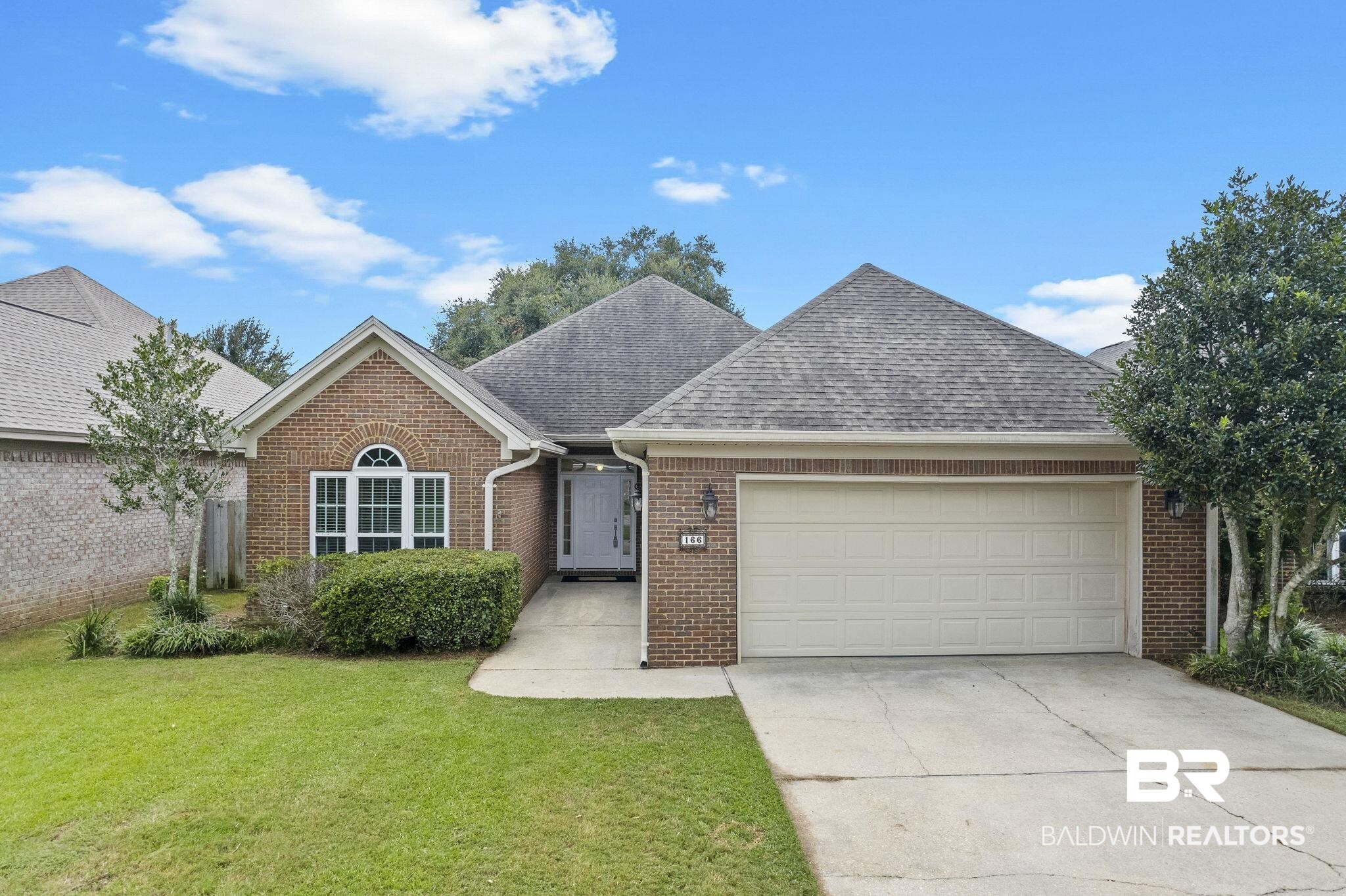 166 Club Drive Fairhope, AL 36532 - Photo 1 of 41 View of front of house featuring a front lawn and a garage