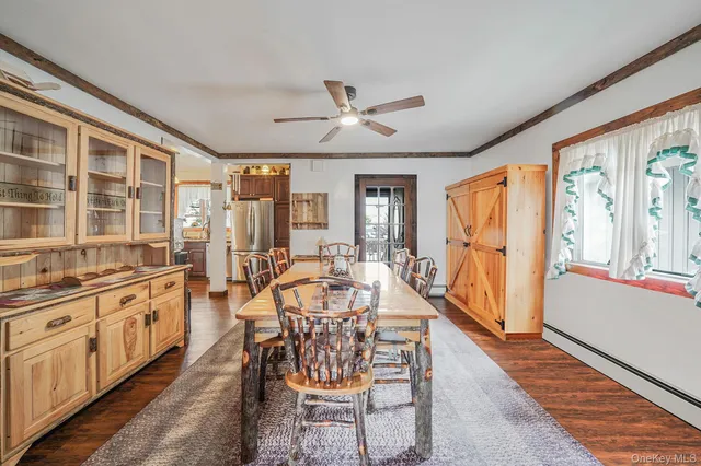a view of a dining room with furniture window and outside view