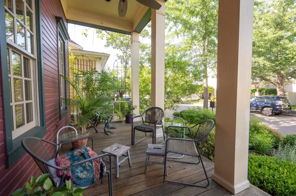 a backyard of a house with outdoor seating