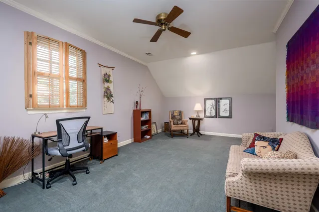 a bedroom with furniture and a window