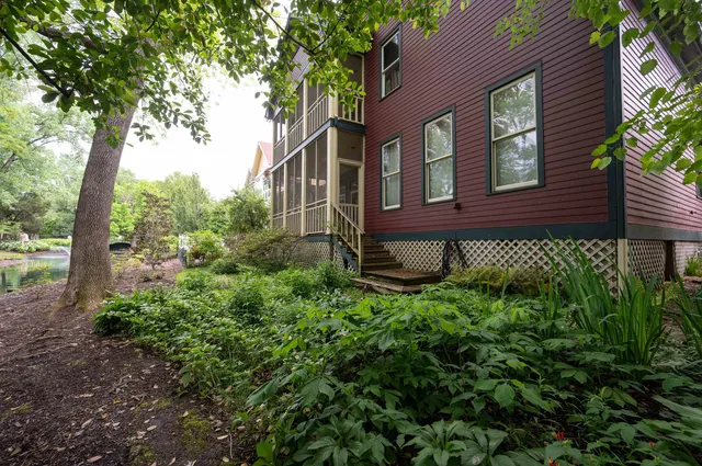 a front view of a house with garden