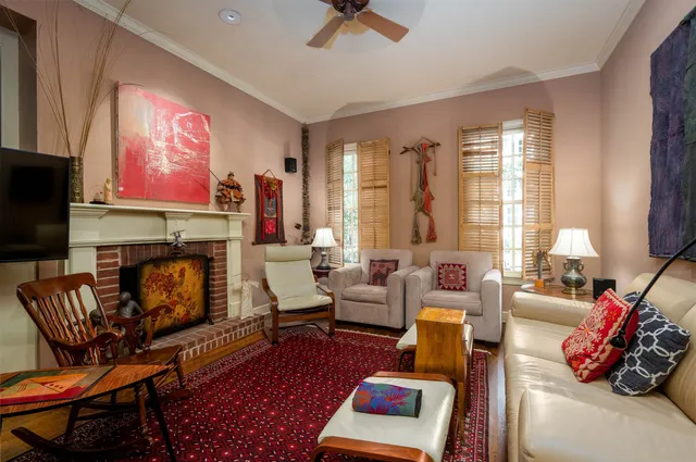 a living room with furniture fireplace and flat screen tv