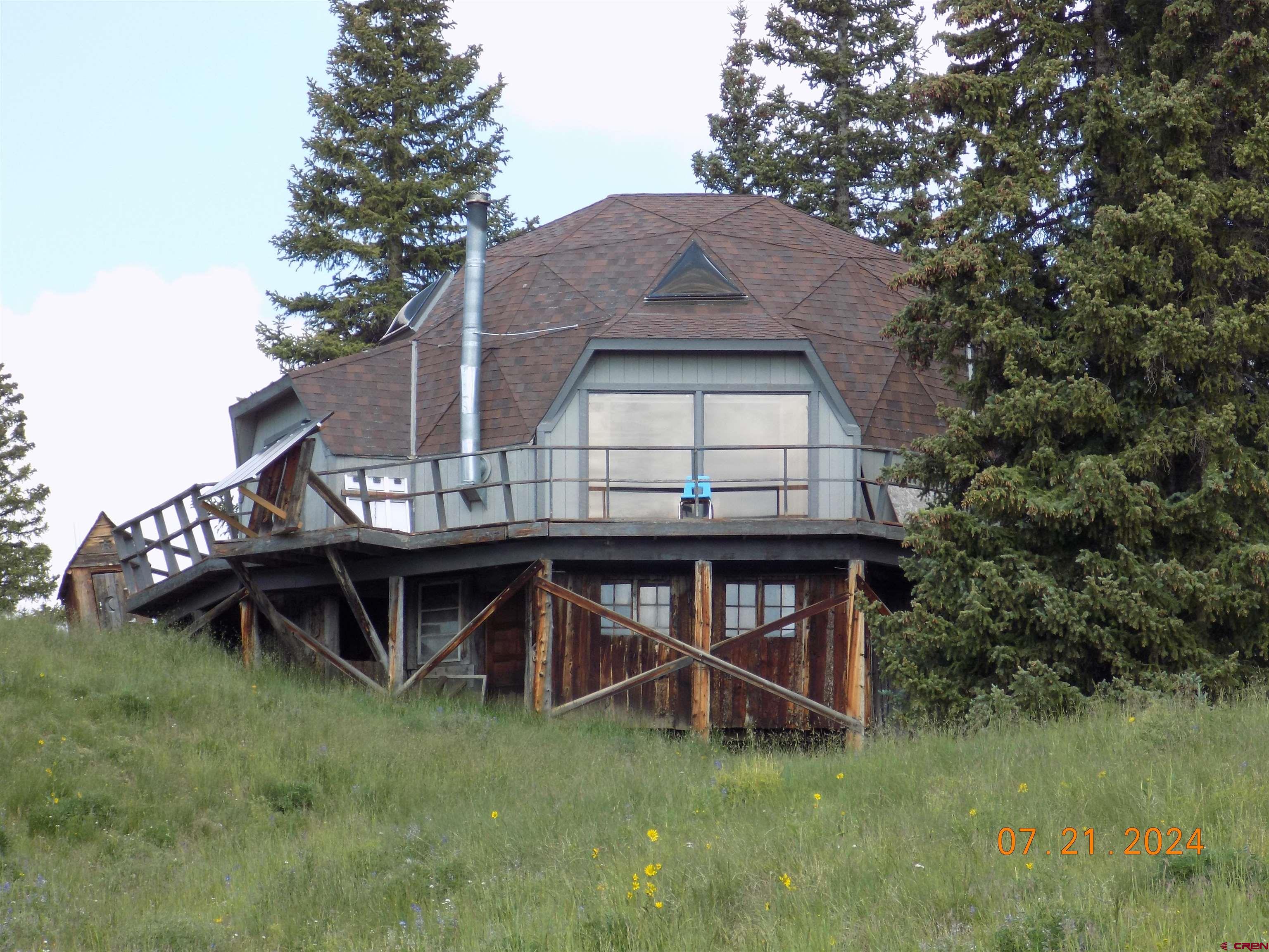 95 Geneva Loop Pitkin, CO 81241 - Photo 1 of 14 a view of a house with a yard