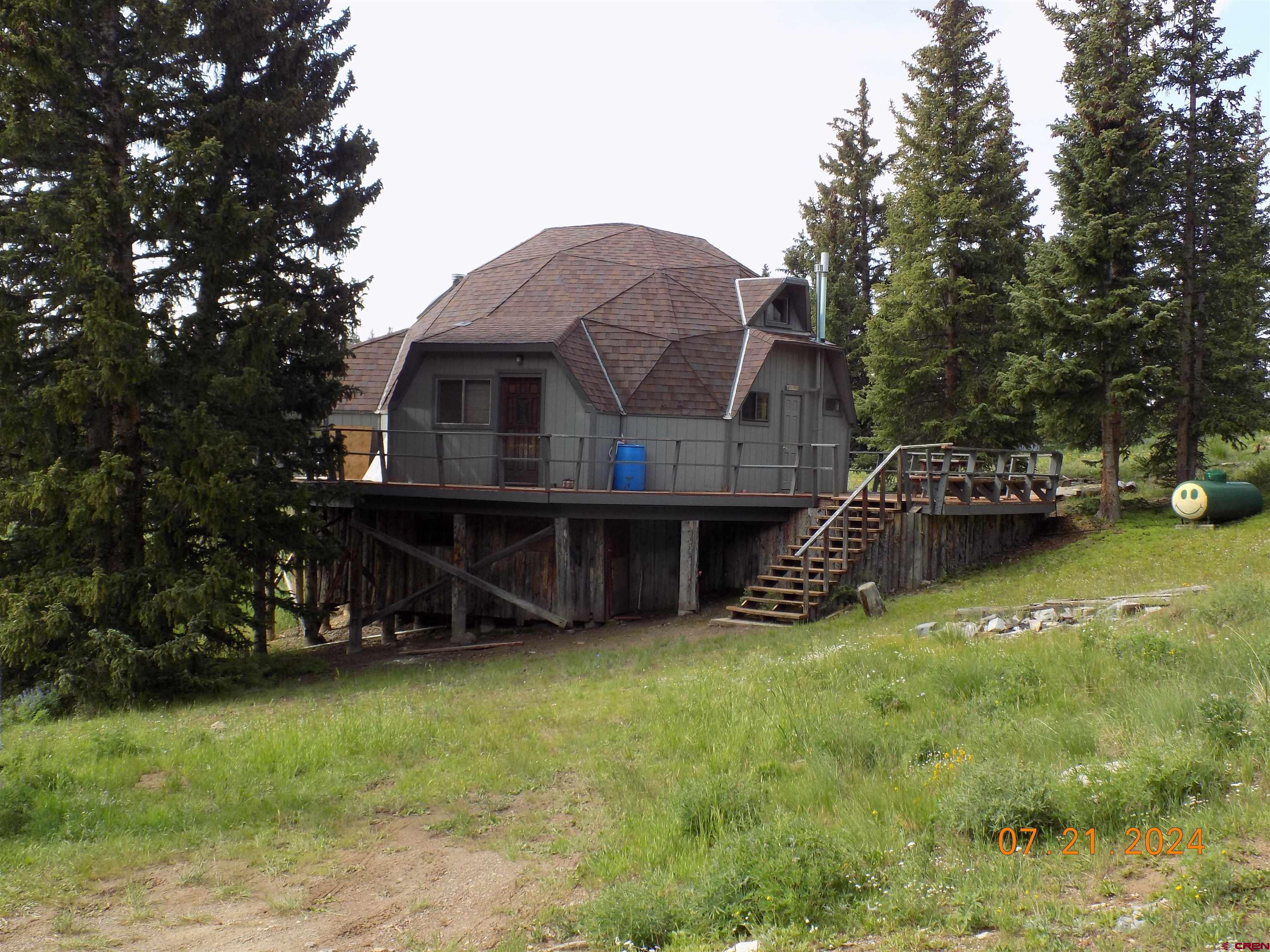 95 Geneva Loop Pitkin, CO 81241 - Photo 3 of 14 a view of a house with a yard and sitting area