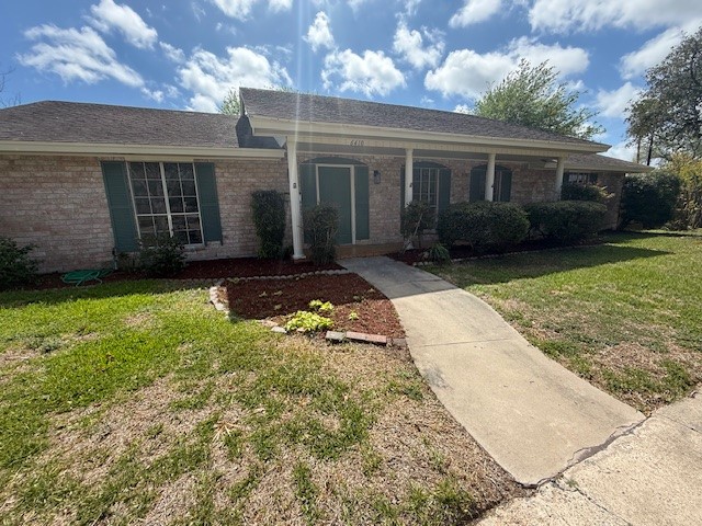 6410 Clearlake Circle Corpus Christi, TX 78413 - Photo 1 of 20 front view of a house with a yard