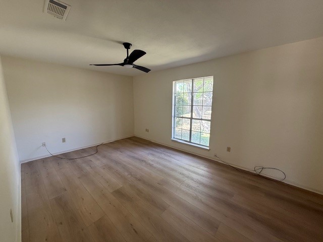 6410 Clearlake Circle Corpus Christi, TX 78413 - Photo 12 of 20 wooden floor in an empty room with a window