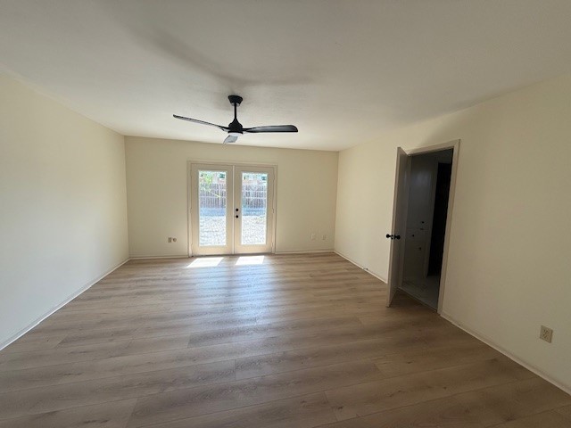 6410 Clearlake Circle Corpus Christi, TX 78413 - Photo 14 of 20 an empty room with wooden floor and windows