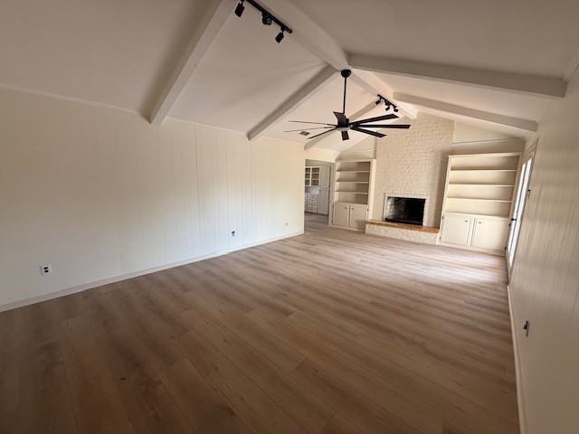 6410 Clearlake Circle Corpus Christi, TX 78413 - Photo 3 of 20 a view of empty room with wooden floor and fireplace