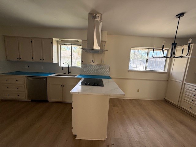 6410 Clearlake Circle Corpus Christi, TX 78413 - Photo 7 of 20 a view of a kitchen with a sink dishwasher and wooden floor
