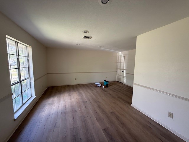 6410 Clearlake Circle Corpus Christi, TX 78413 - Photo 9 of 20 an empty room with wooden floor and windows