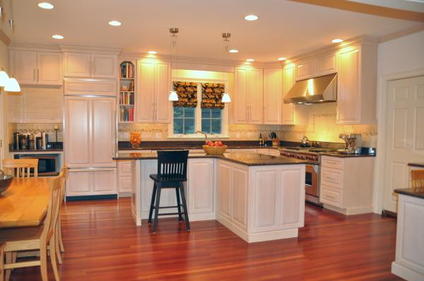 39 Windsor Road Wellesley, MA 02481 - Photo 14 of 23 a kitchen with stainless steel appliances granite countertop wooden floor a stove a sink a refrigerator and chairs