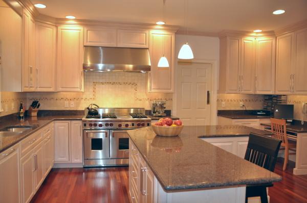 39 Windsor Road Wellesley, MA 02481 - Photo 16 of 23 a kitchen with stainless steel appliances granite countertop a stove a sink dishwasher and a refrigerator with wooden cabinets