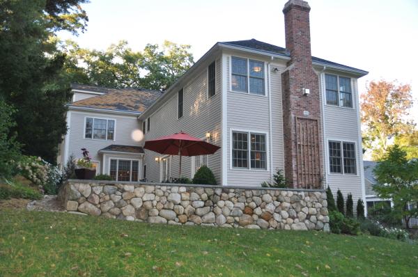 39 Windsor Road Wellesley, MA 02481 - Photo 18 of 23 a front view of a house with garden