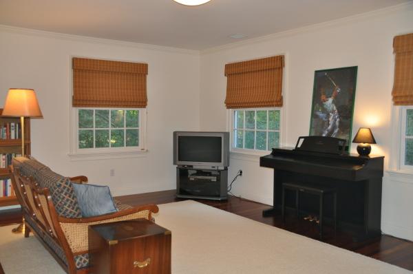 39 Windsor Road Wellesley, MA 02481 - Photo 20 of 23 a living room with furniture and a flat screen tv