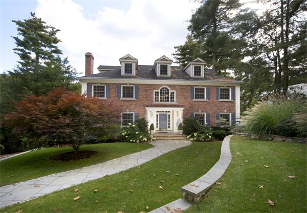 39 Windsor Road Wellesley, MA 02481 - Photo 9 of 23 a front view of a house with a yard and trees