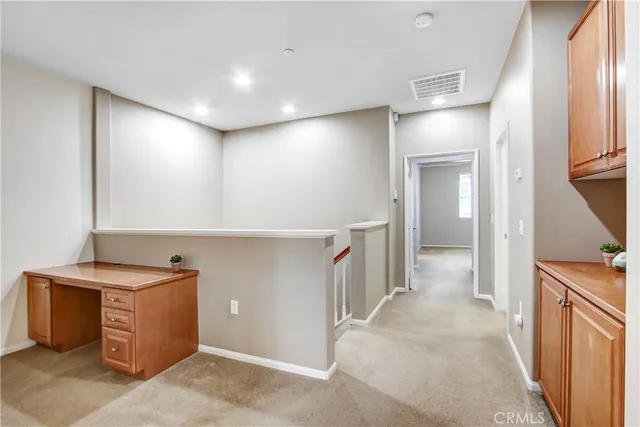 a view of a hallway with workspace