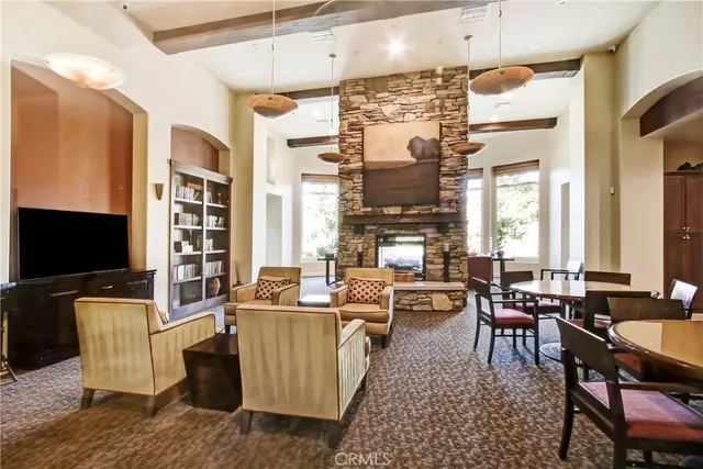 a living room with fireplace furniture and a flat screen tv