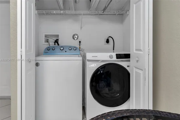 a view of washer and dryer in a utility room