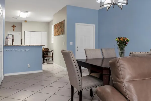 a dining room with furniture and window