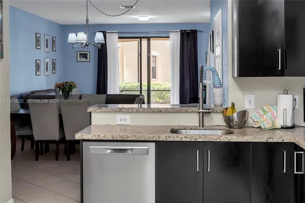 a kitchen with sink and window