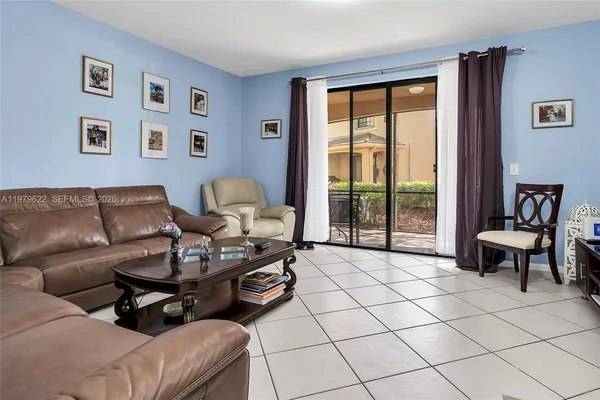 a living room with furniture and a window