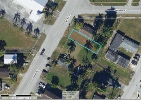 an aerial view of houses with outdoor space
