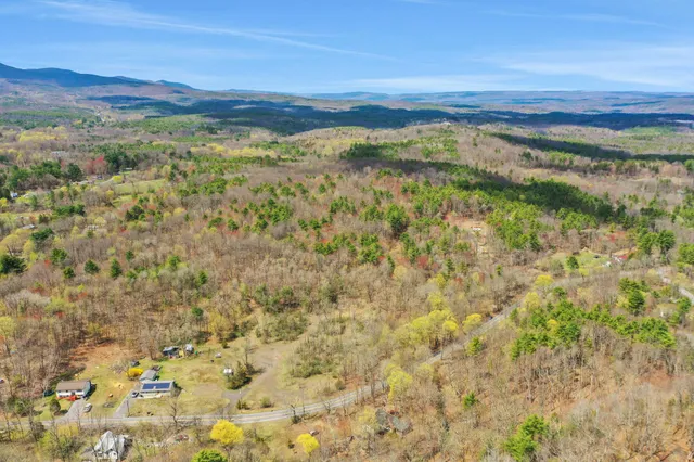 a view of mountain with an ocean