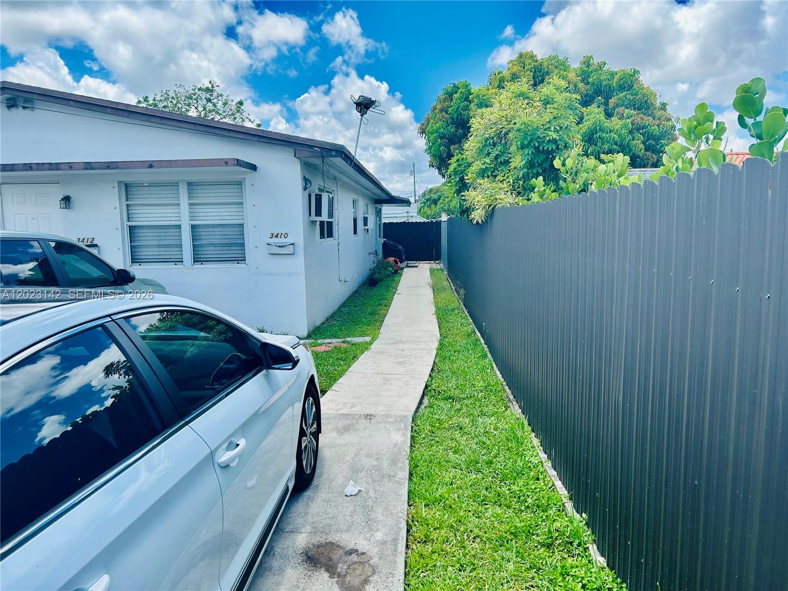 3410 Southwest 89th Court Miami, FL 33165 - Photo 3 of 18 a view of a house with a yard