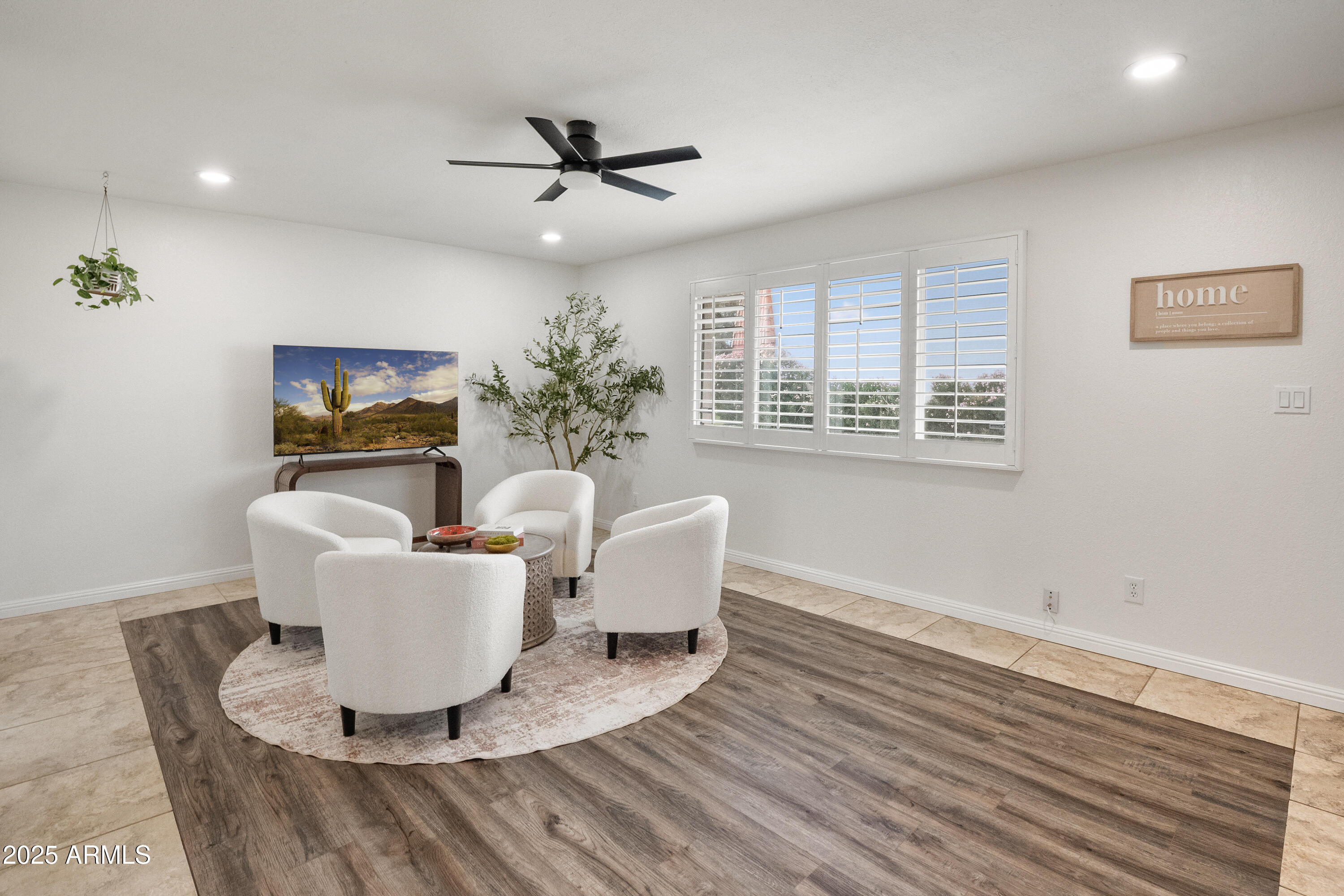 3928 North Granite Reef Road Scottsdale, AZ 85251 - Photo 17 of 30 a living room with furniture and a flat screen tv
