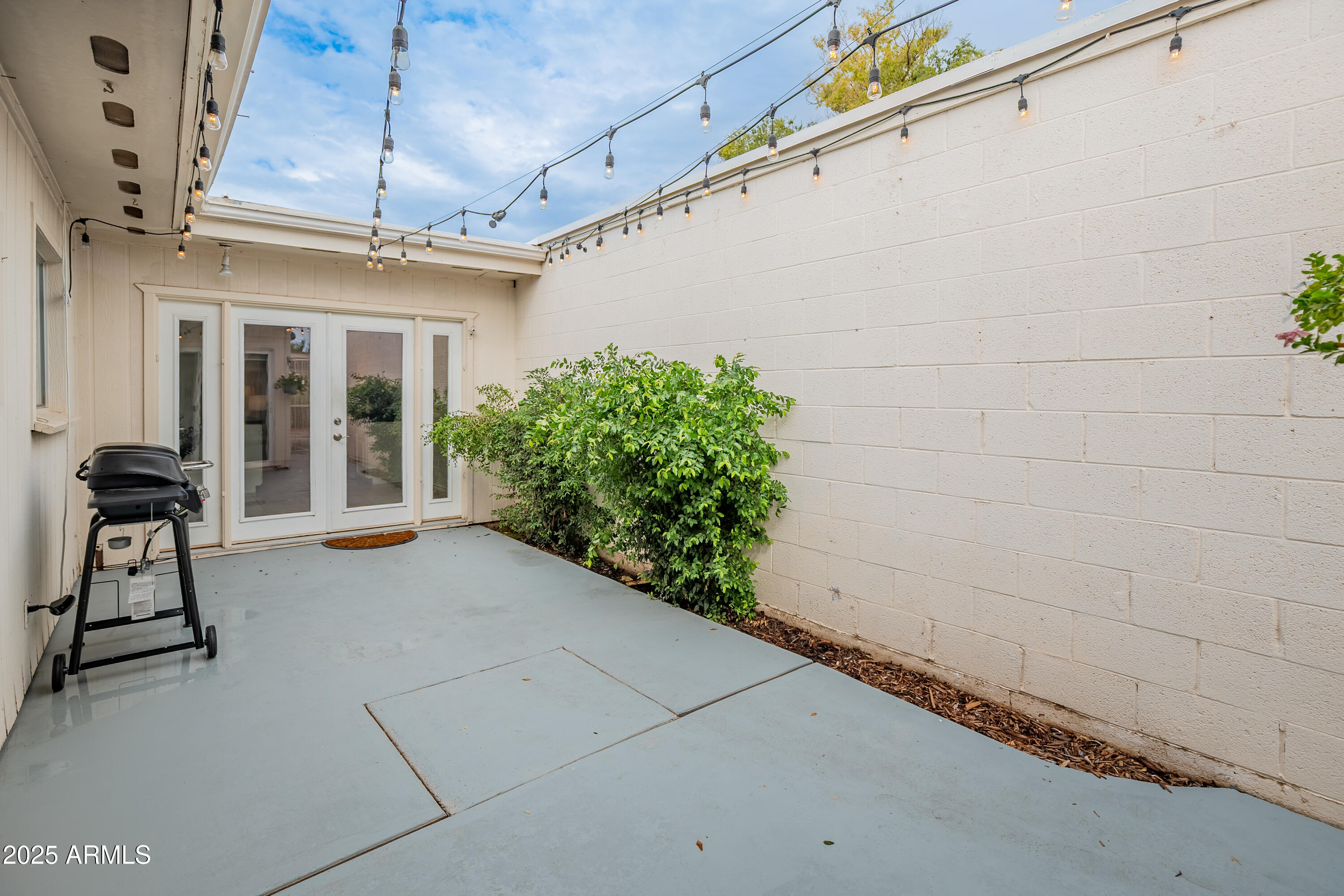 3928 North Granite Reef Road Scottsdale, AZ 85251 - Photo 19 of 30 a view of a patio with table and chairs and potted plants