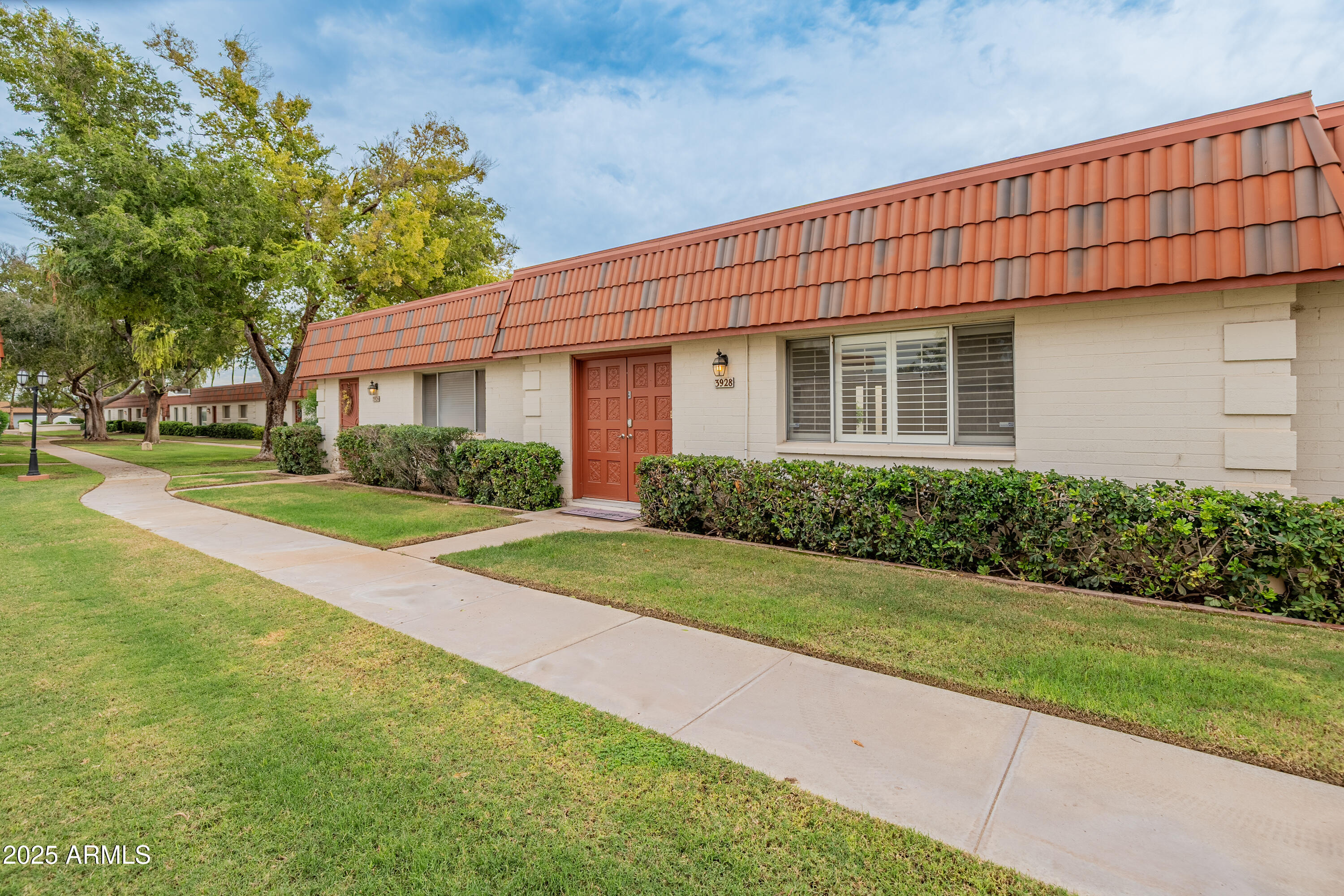 3928 North Granite Reef Road Scottsdale, AZ 85251 - Photo 23 of 30 a front view of a house with a yard