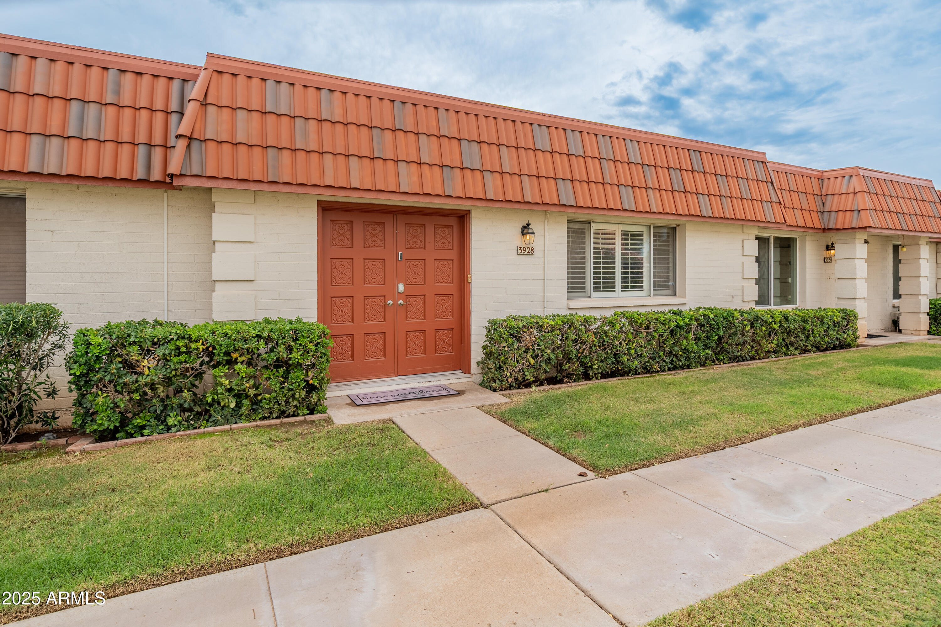 3928 North Granite Reef Road Scottsdale, AZ 85251 - Photo 29 of 30 a front view of a house with a yard