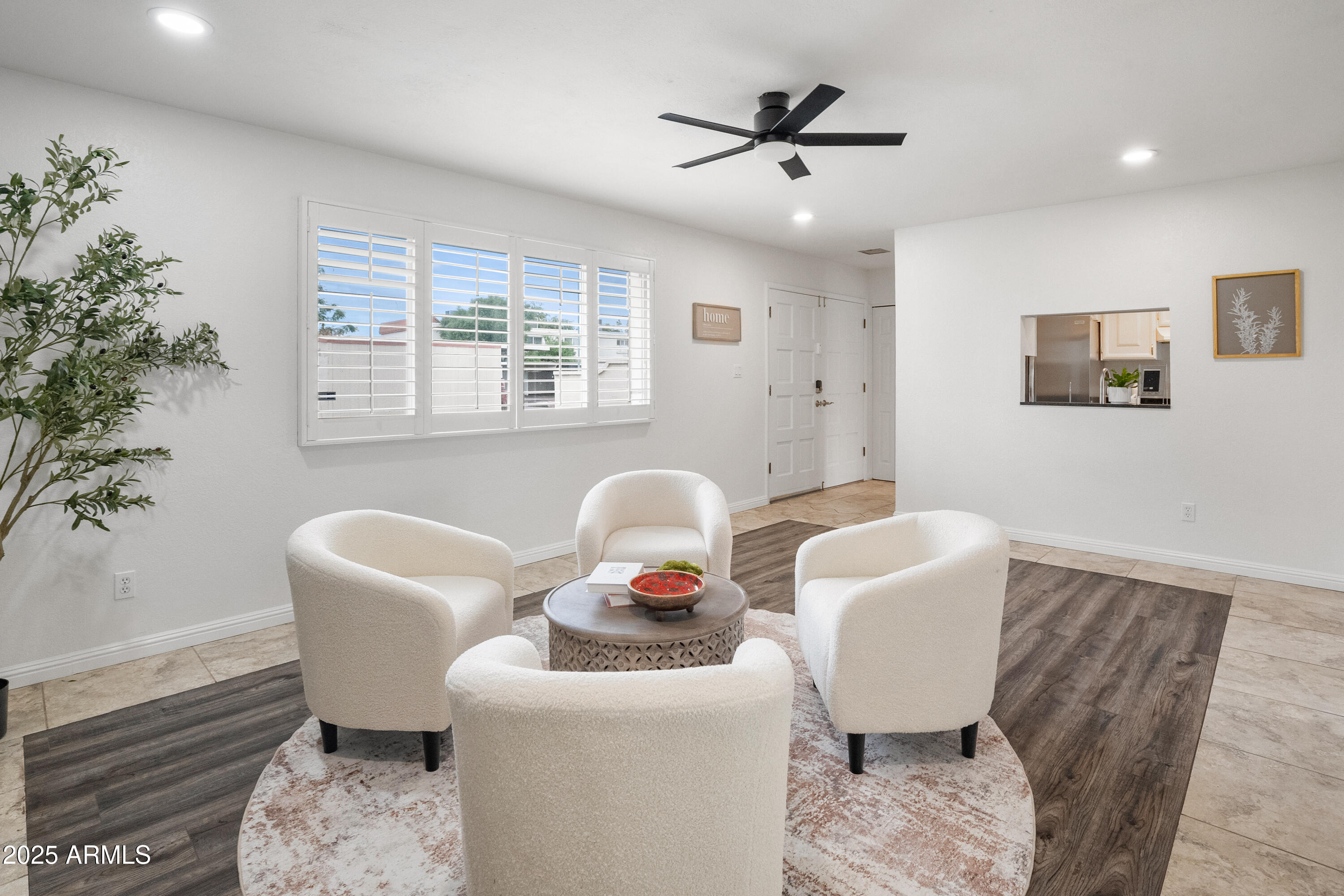 3928 North Granite Reef Road Scottsdale, AZ 85251 - Photo 2 of 30 a living room with furniture a window and a potted plant