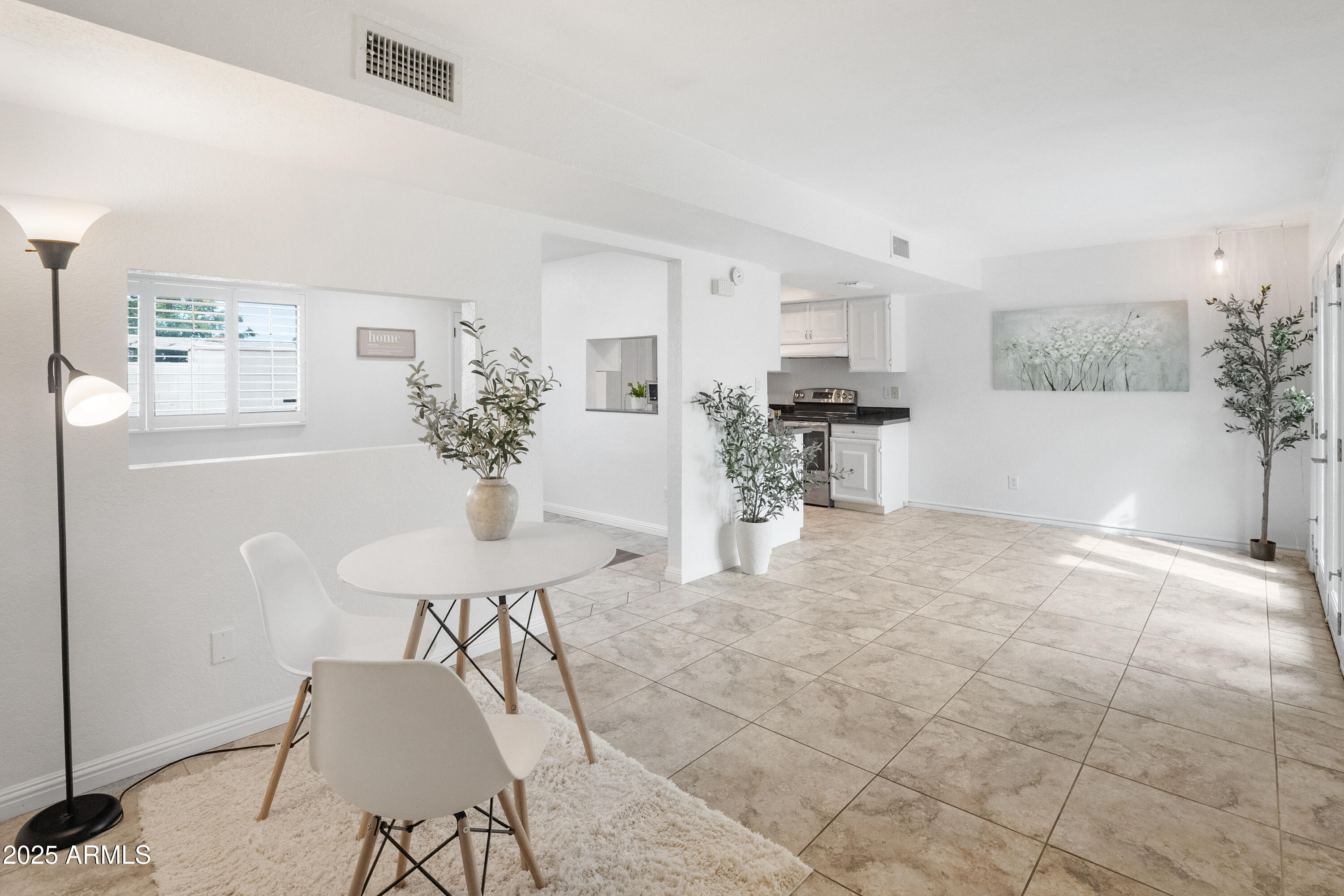 3928 North Granite Reef Road Scottsdale, AZ 85251 - Photo 3 of 30 a view of a dining room with furniture
