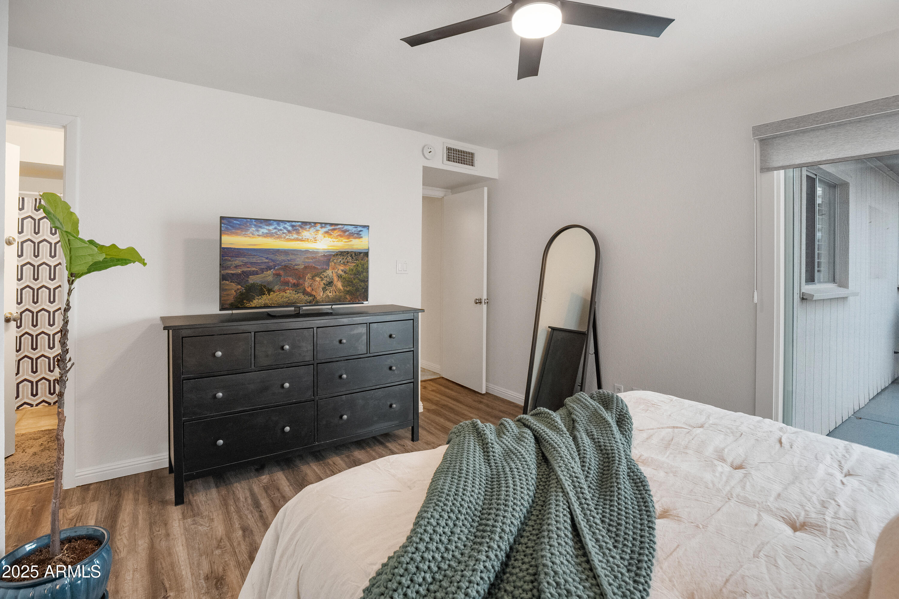 3928 North Granite Reef Road Scottsdale, AZ 85251 - Photo 5 of 30 a bedroom with a bed and a dresser