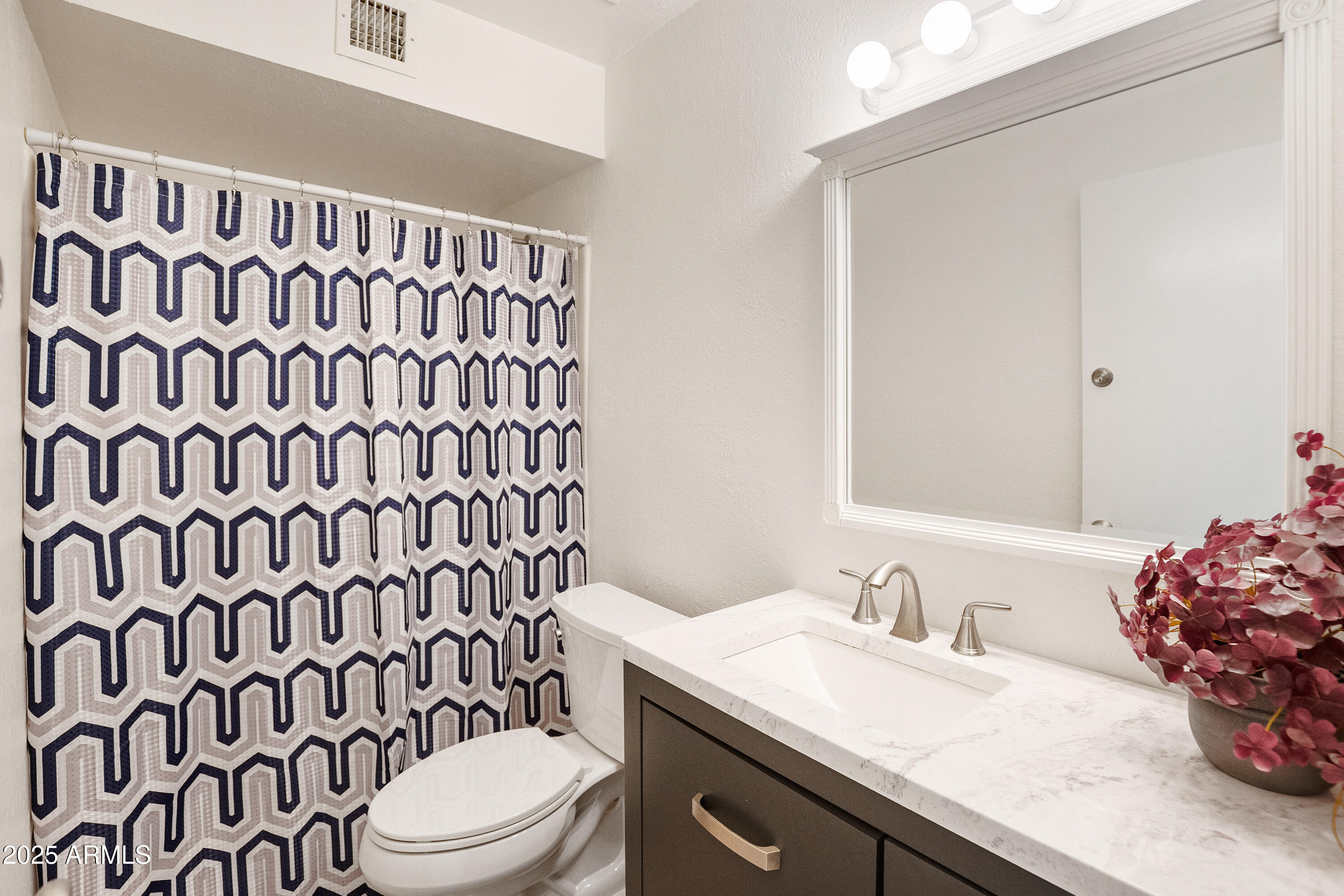 3928 North Granite Reef Road Scottsdale, AZ 85251 - Photo 6 of 30 a bathroom with a granite countertop sink and a mirror