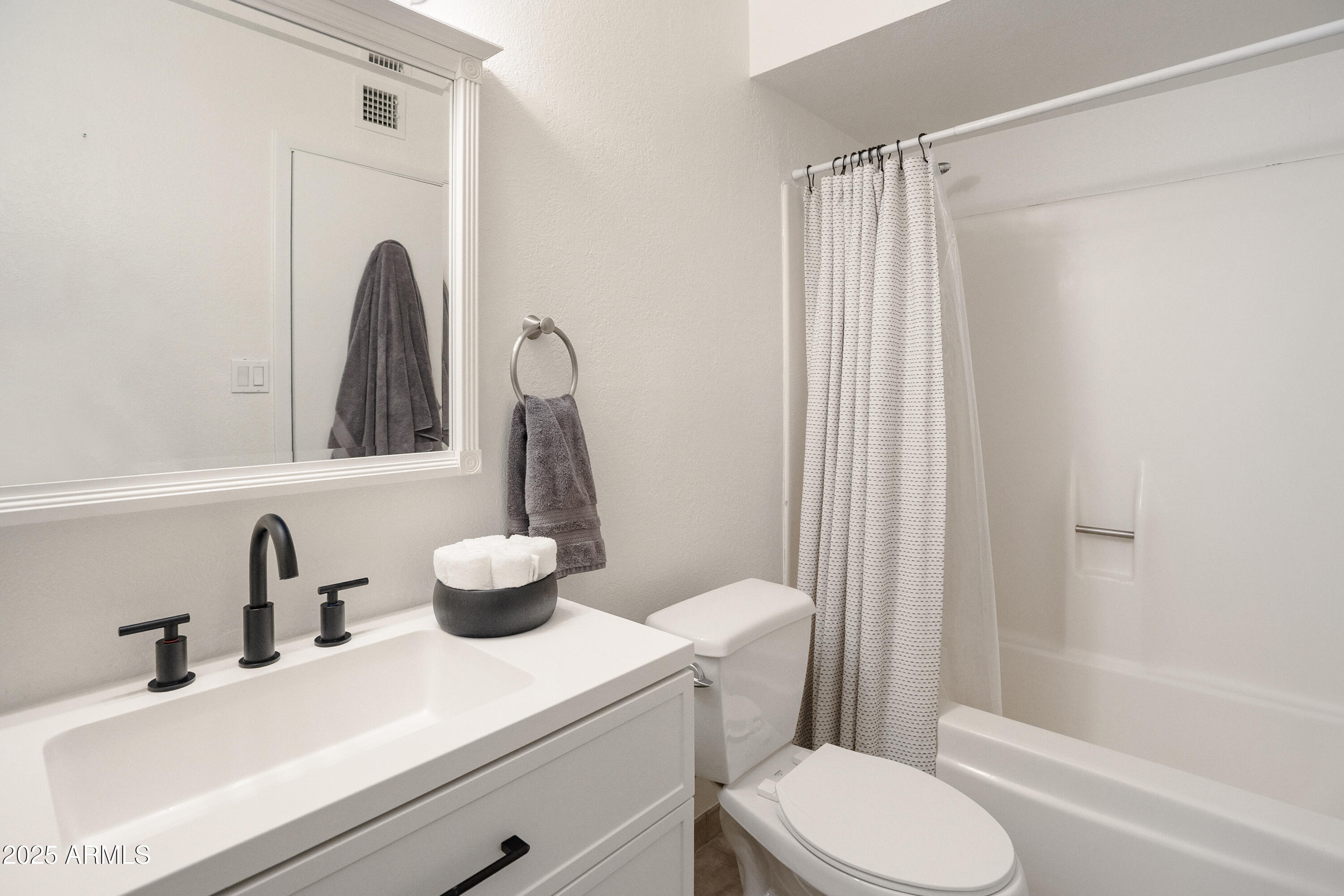 3928 North Granite Reef Road Scottsdale, AZ 85251 - Photo 9 of 30 a bathroom with a sink toilet and shower