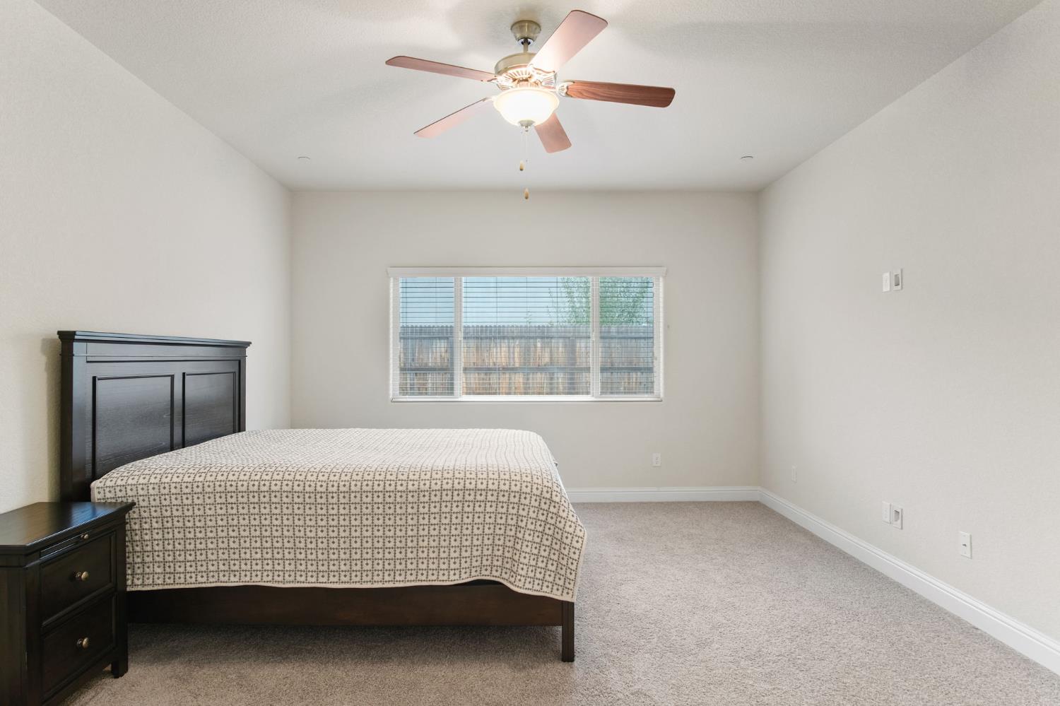 3790 Bonifacio Way Merced, CA 95340 - Photo 12 of 21 a bedroom with a bed and a window