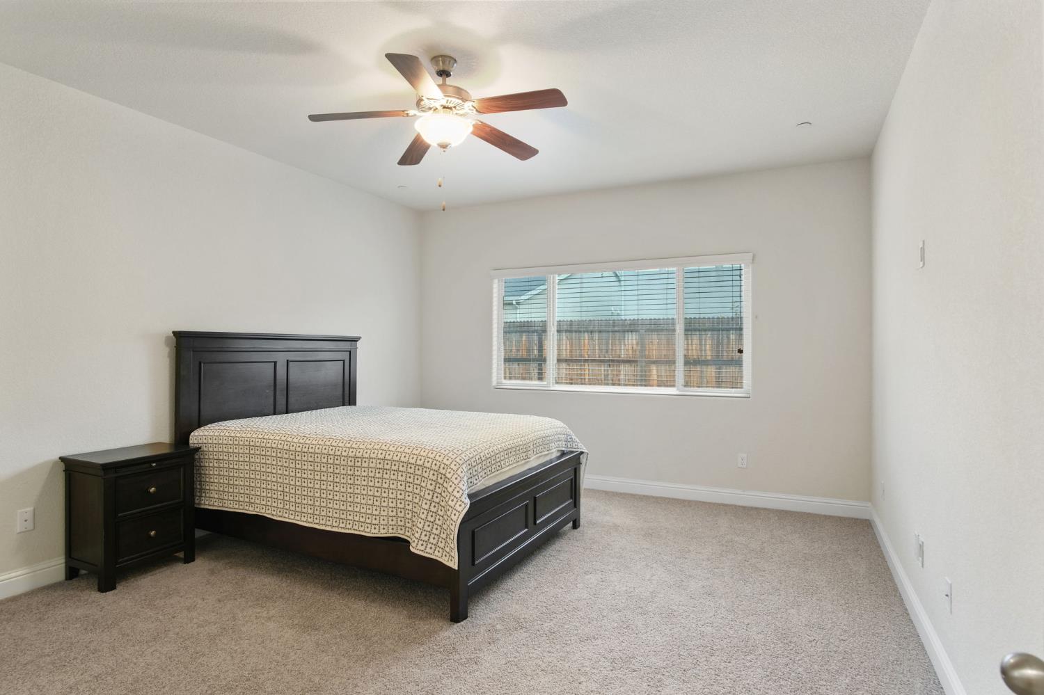 3790 Bonifacio Way Merced, CA 95340 - Photo 13 of 21 a bedroom with a bed and a window