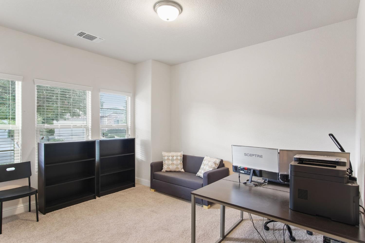 3790 Bonifacio Way Merced, CA 95340 - Photo 15 of 21 a view of workspace with furniture and window