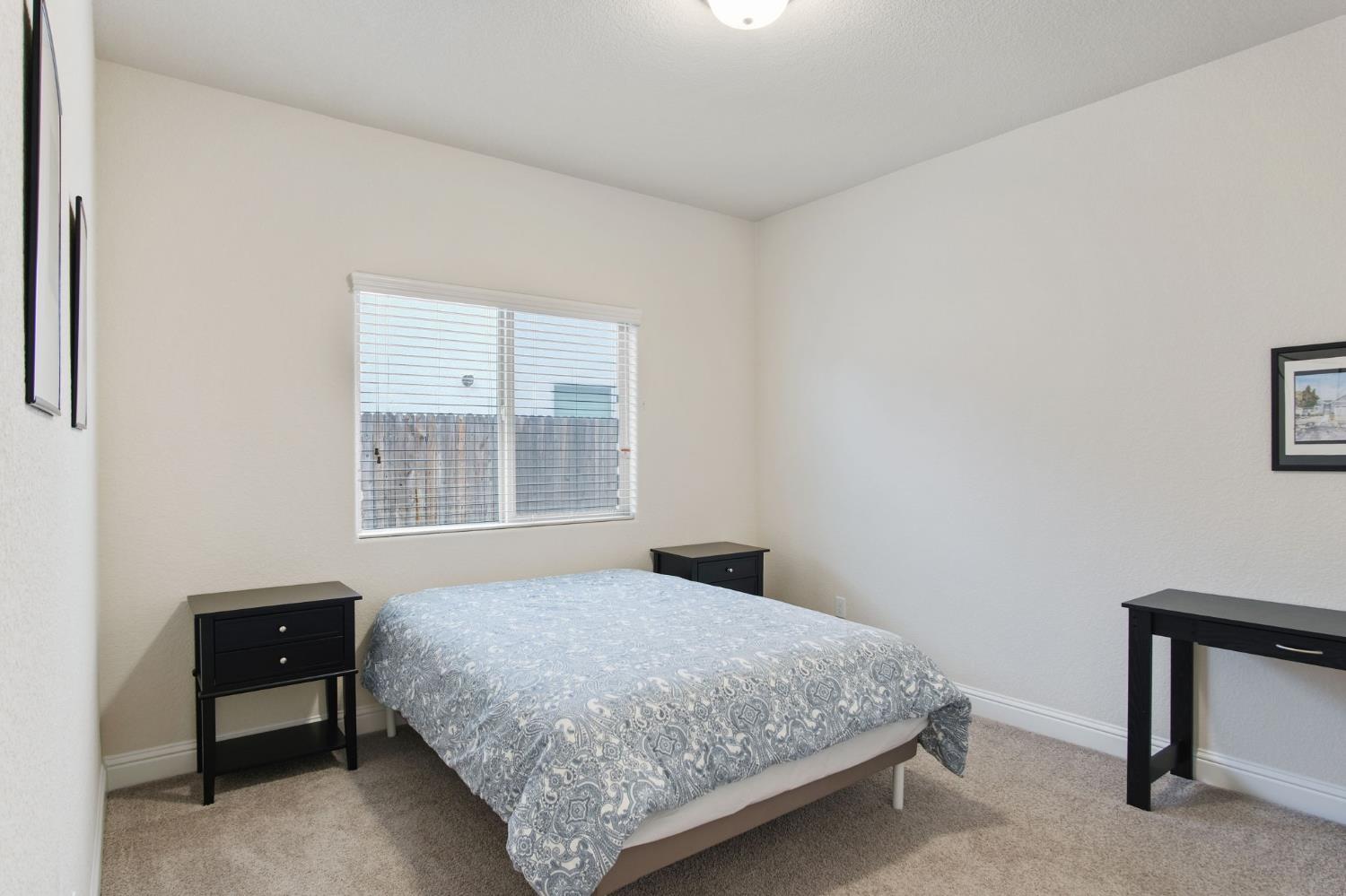 3790 Bonifacio Way Merced, CA 95340 - Photo 17 of 21 a bedroom with a bed and a window