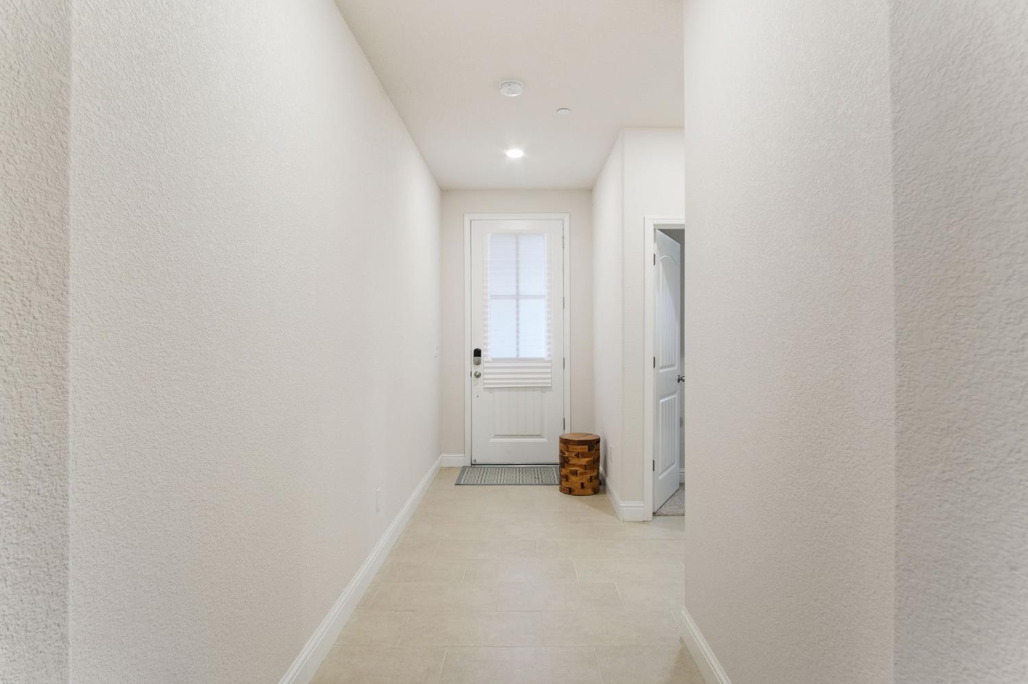 3790 Bonifacio Way Merced, CA 95340 - Photo 4 of 21 a view of a hallway with wooden shelves