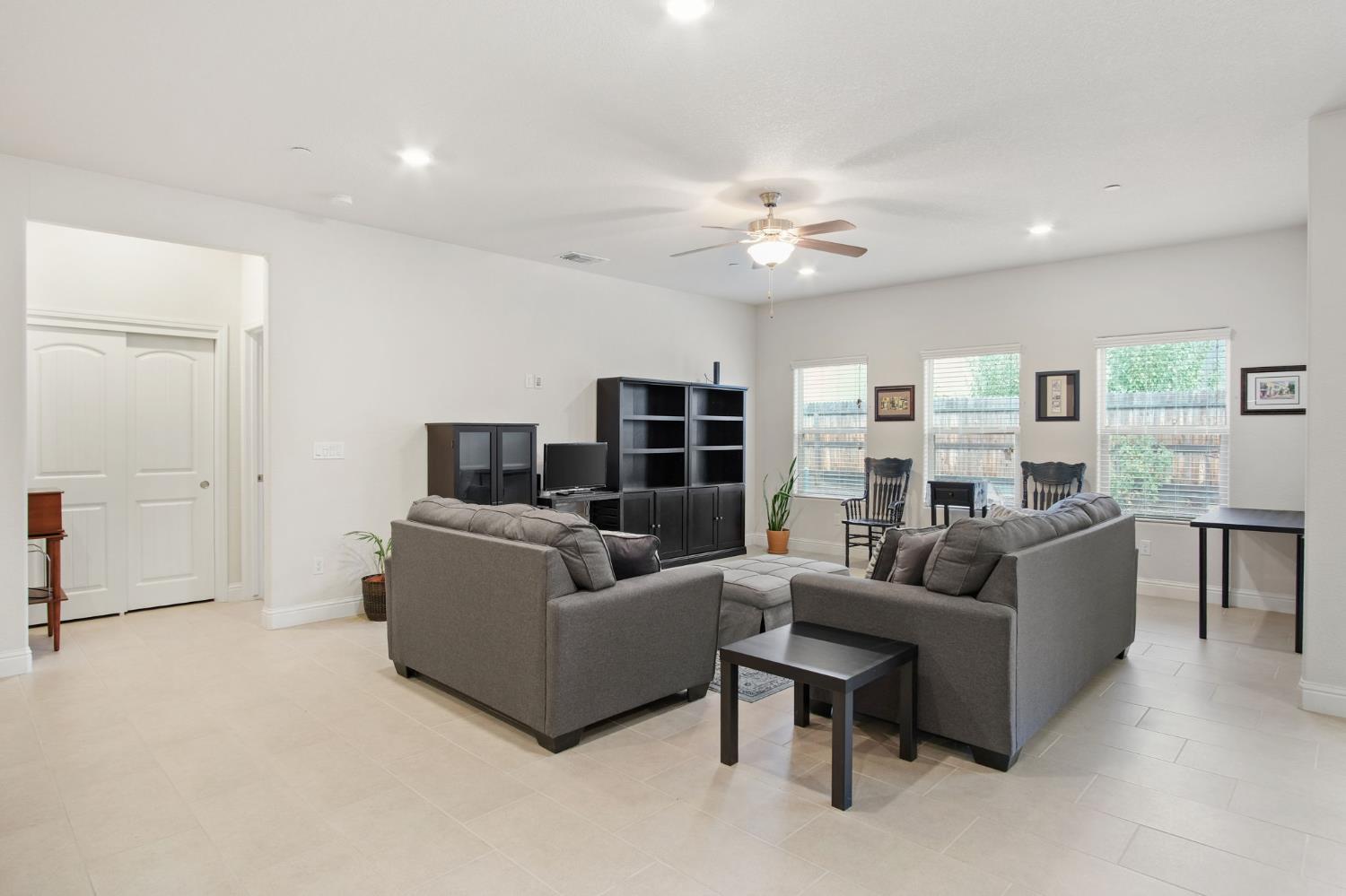 3790 Bonifacio Way Merced, CA 95340 - Photo 5 of 21 a living room with furniture and a flat screen tv