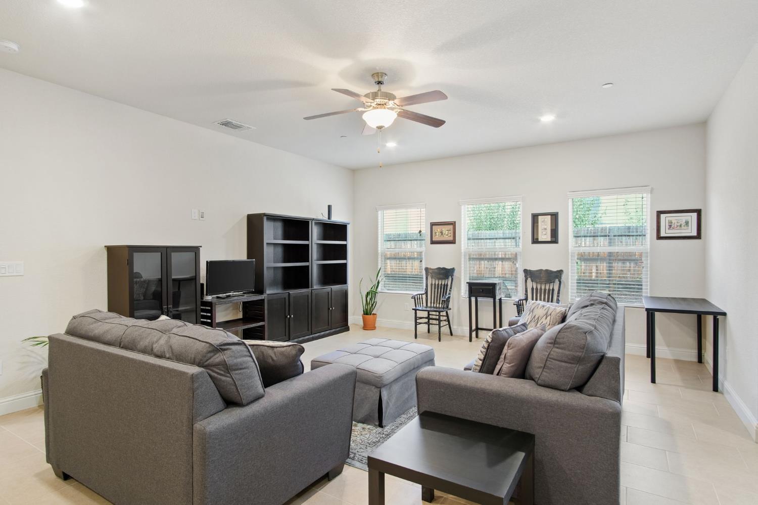 3790 Bonifacio Way Merced, CA 95340 - Photo 6 of 21 a living room with furniture and a flat screen tv