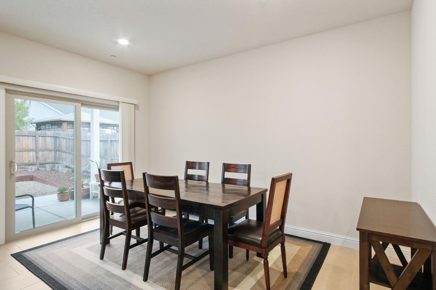 3790 Bonifacio Way Merced, CA 95340 - Photo 7 of 21 a view of a dining room with furniture and wooden floor