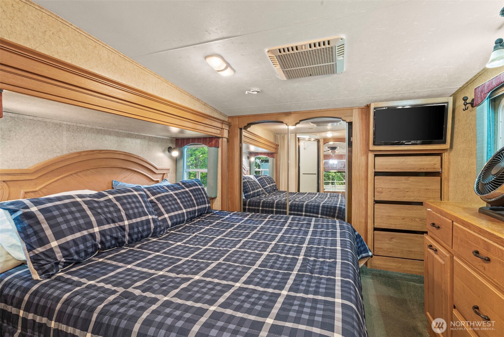 560 North Beacon Point Loop North Lilliwaup, WA 98555 - Photo 12 of 40 a front view of a house with a large window