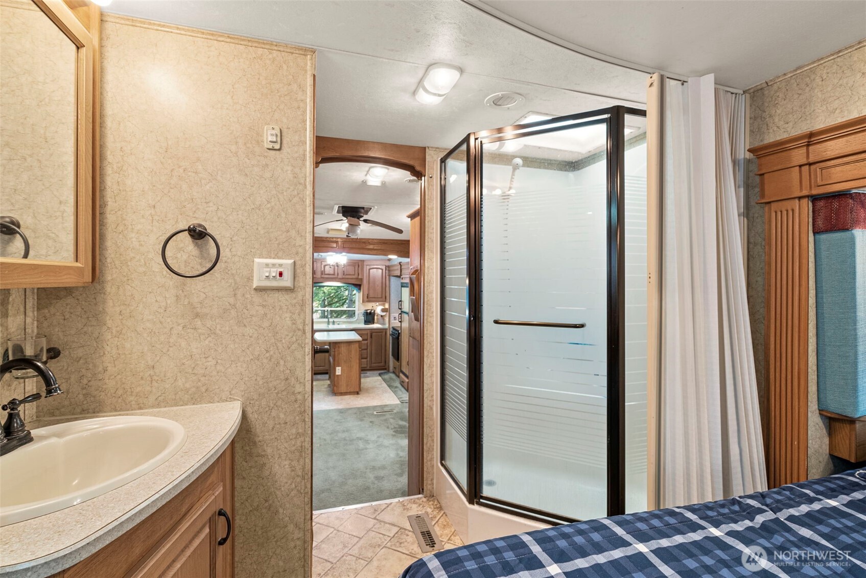 560 North Beacon Point Loop North Lilliwaup, WA 98555 - Photo 13 of 40 a bathroom with a tub and a sink