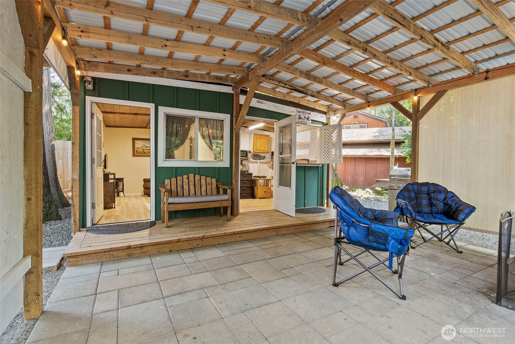 560 North Beacon Point Loop North Lilliwaup, WA 98555 - Photo 15 of 40 a view of a porch with a table and chairs